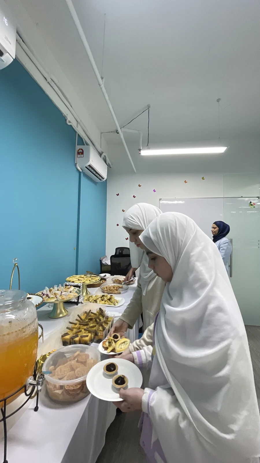 The Family Day table — pastries and a drink dispenser