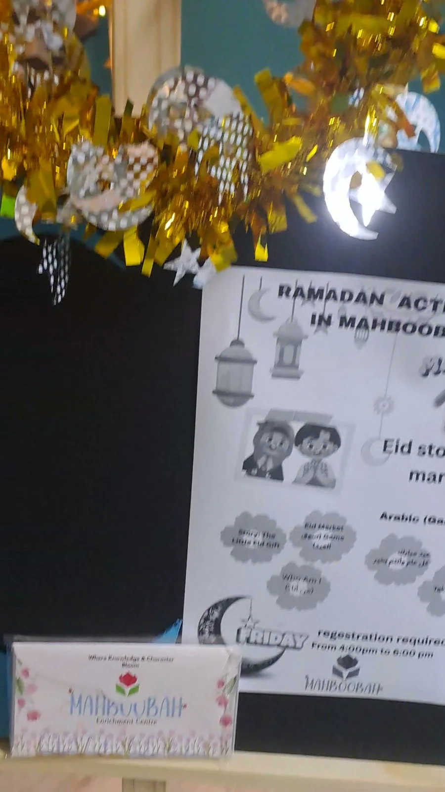 The Ramadan in Mahboobah flyer on an easel