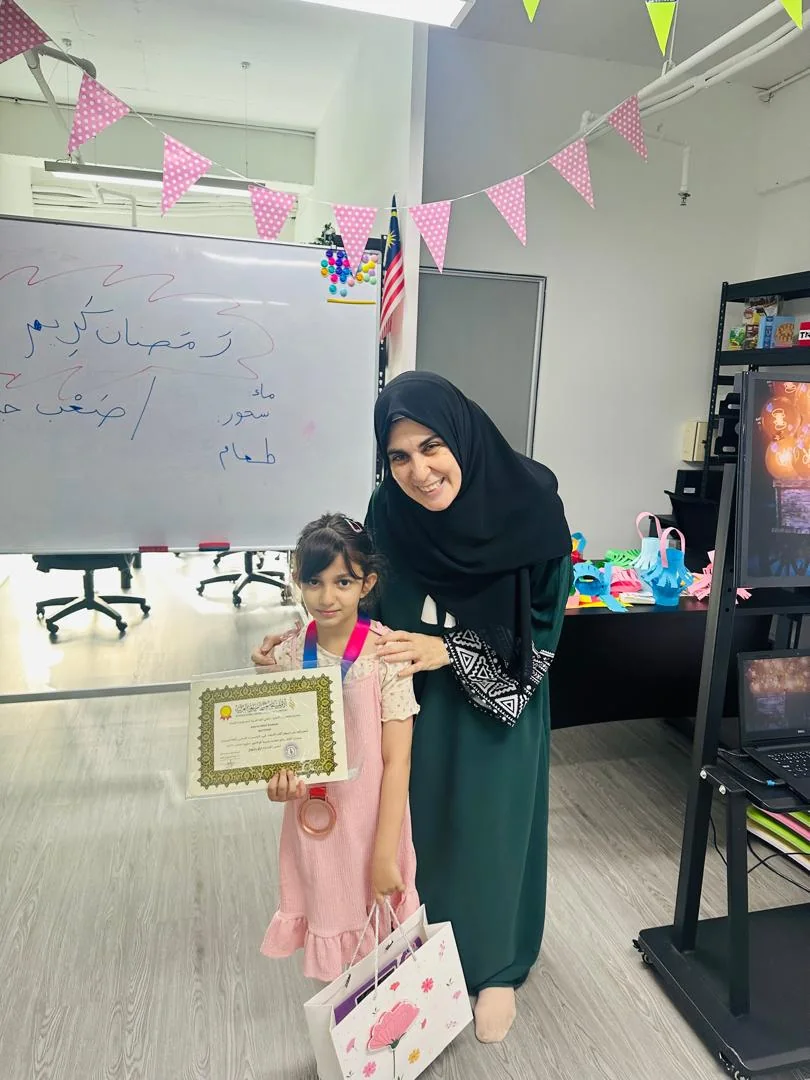 A Ramadan morning — certificate, gift, and Teacher Mays